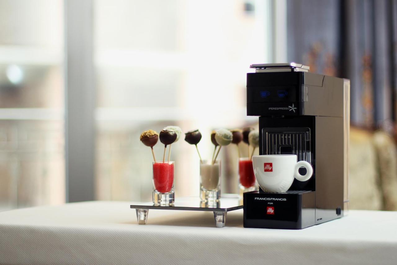 Orion Hotel Bishkek Bagian luar foto A Nespresso Vertuoline coffee machine