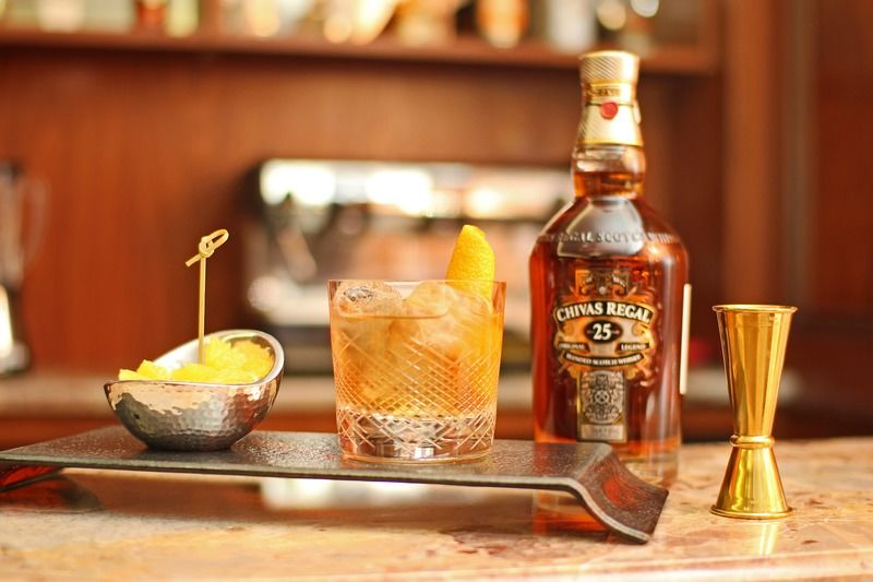 Orion Hotel Bishkek Bagian luar foto A bottle of 25 year old Chivas Regal