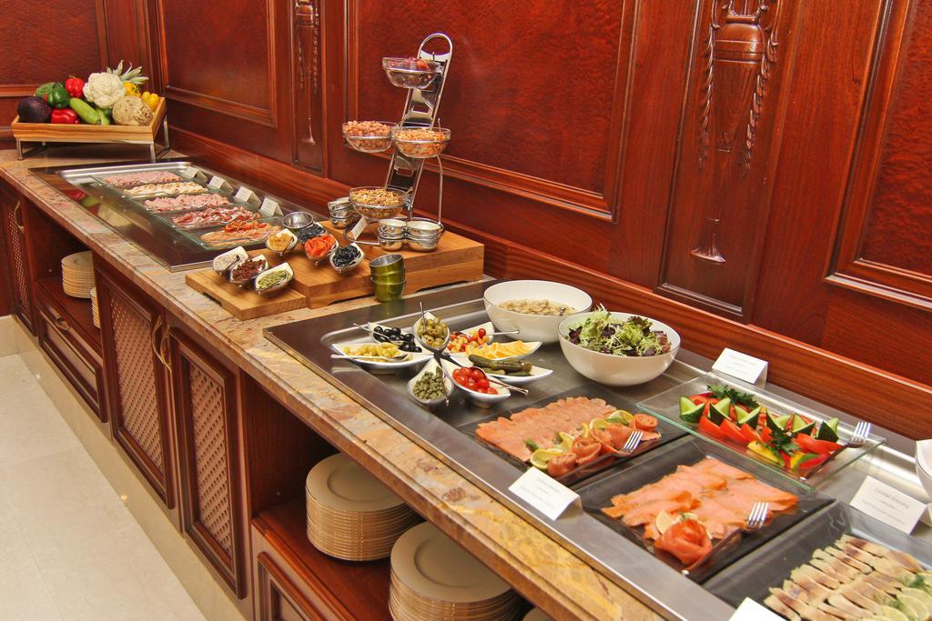 Orion Hotel Bishkek Bagian luar foto A buffet