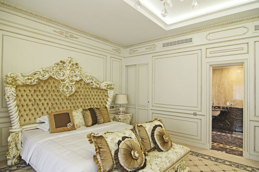 Orion Hotel Bishkek Bagian luar foto A bedroom in the hotel