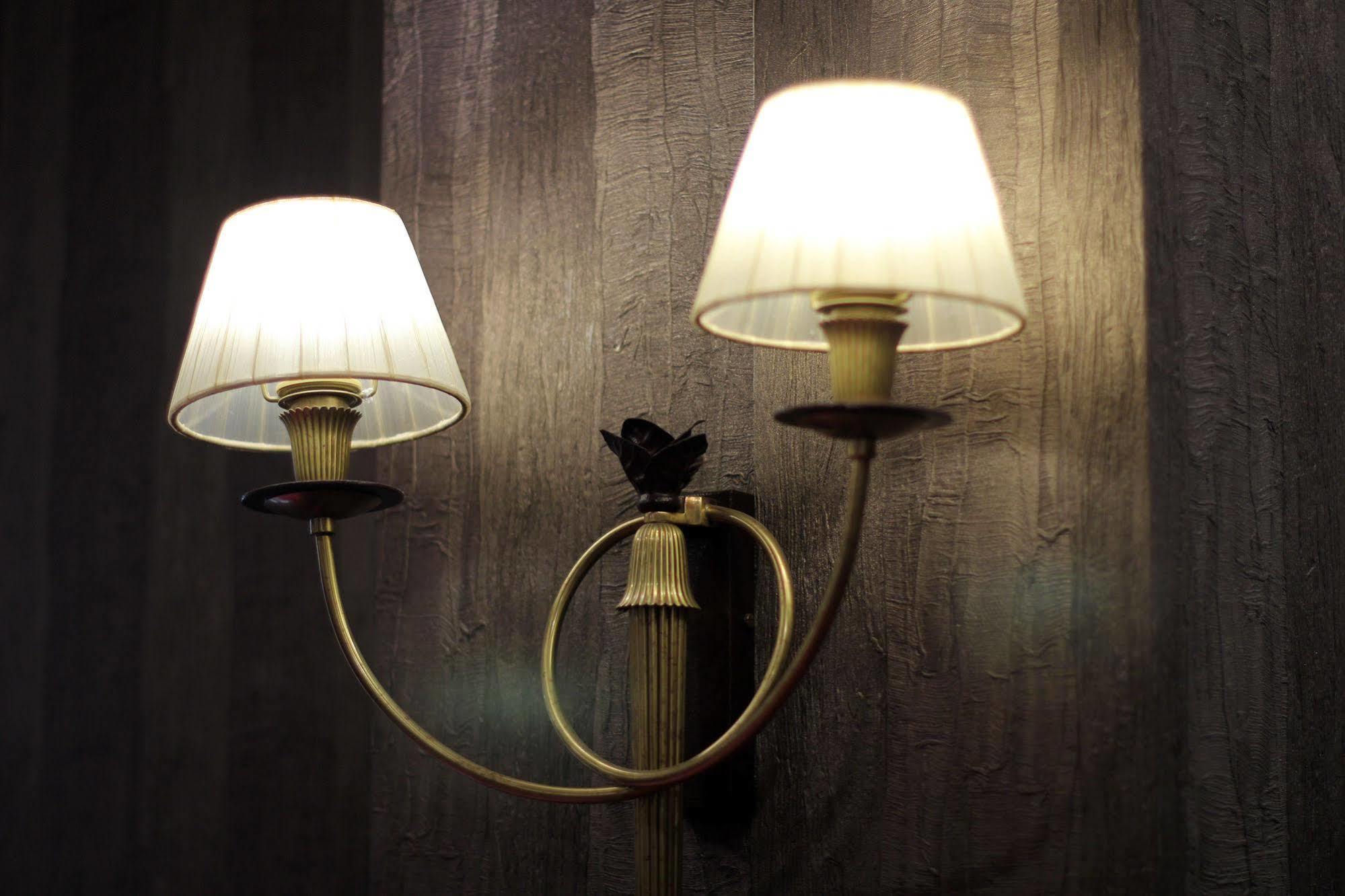 Orion Hotel Bishkek Bagian luar foto A wall light